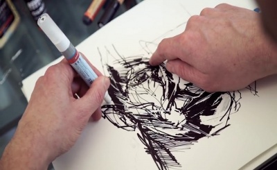 A man drawing Anamorphic Art