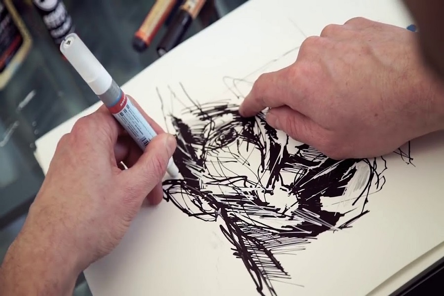 A man drawing Anamorphic Art