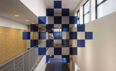 Blue and white checked designs being used in interior architecture with anamorphic illusions.