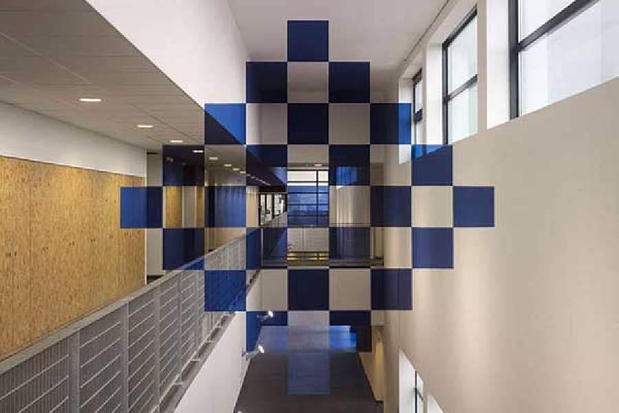 Blue and white checked designs being used in interior architecture with anamorphic illusions.