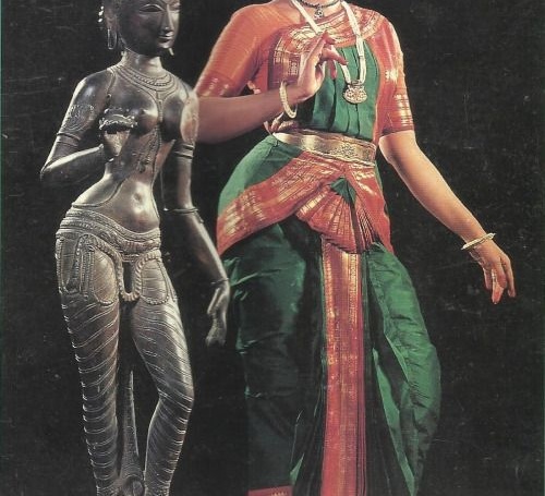 An image of a Sculpture and a girl with Bharatanatyam pose.