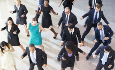 Employees dancing and being stress-free at work.